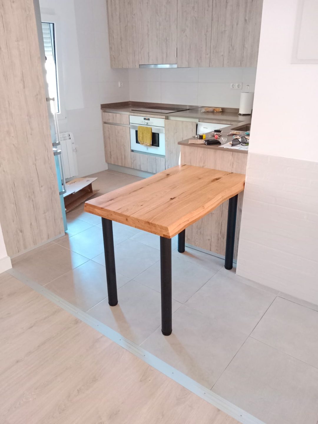 Cocina reformada con muebles de madera